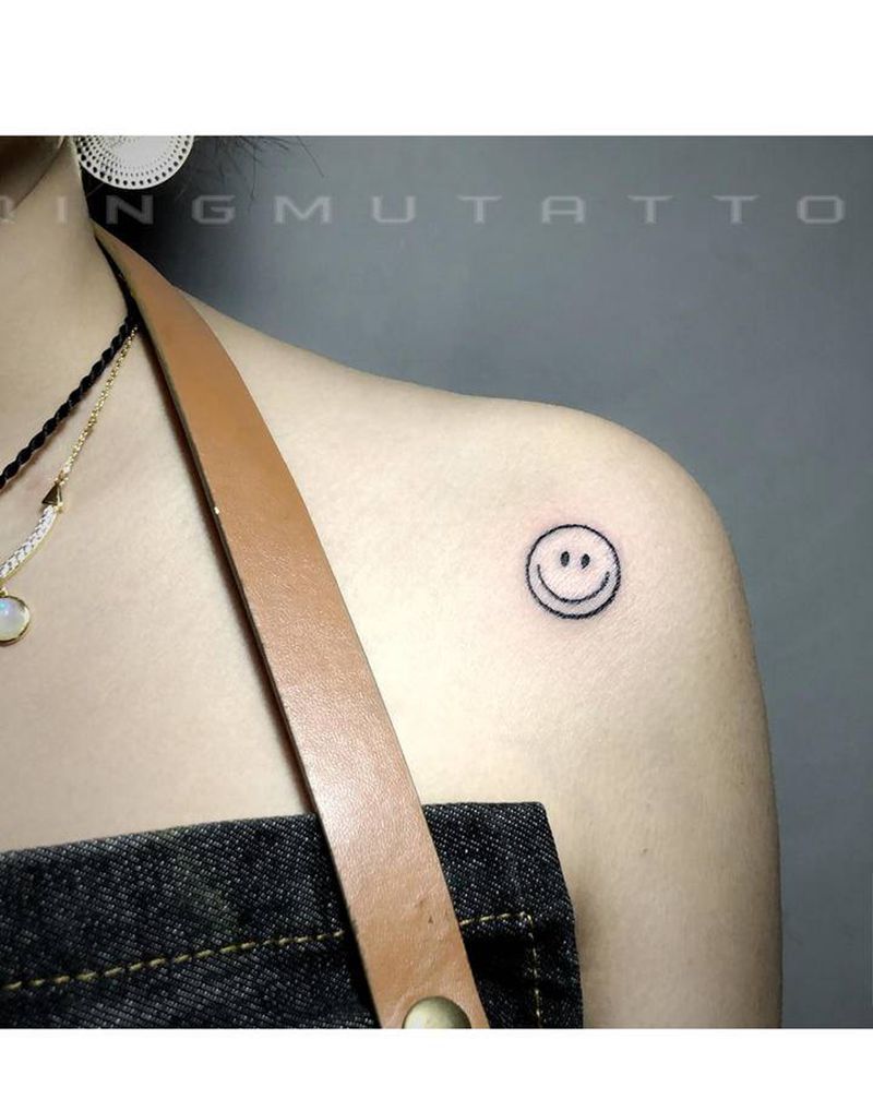 笑脸纹身图片_手臂肩部几何纹身图案