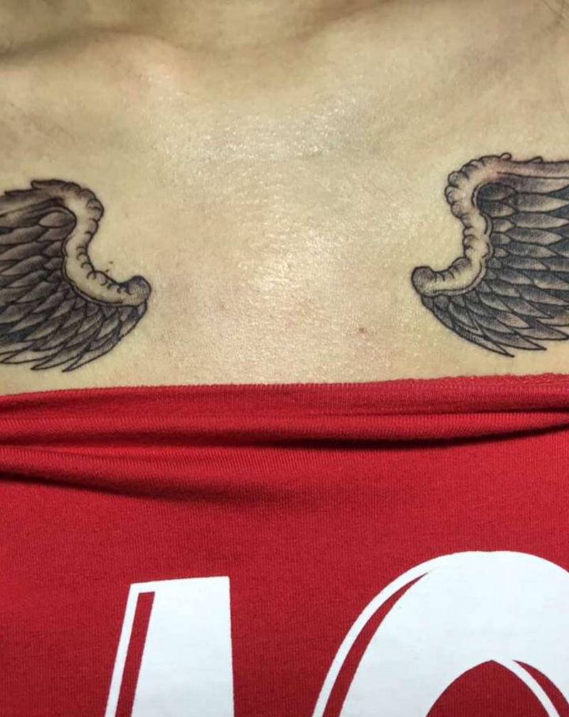 臂膀纹身图片_胸部纹身图案