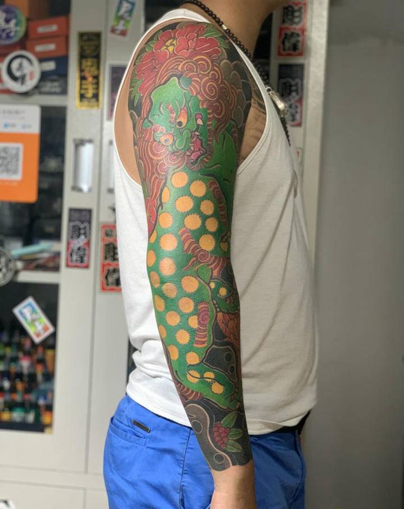 唐狮花臂纹身图片_手臂老传统纹身图案