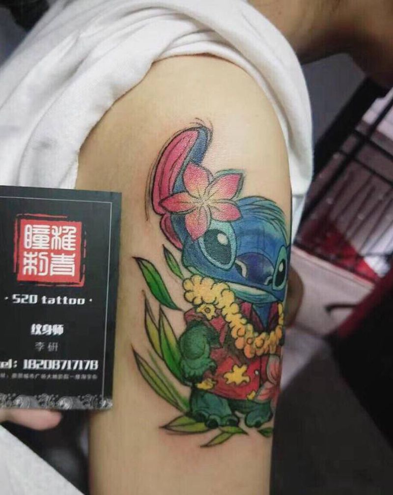 夏威夷史迪仔纹身图片_手臂New School水彩遮盖卡通纹身图案