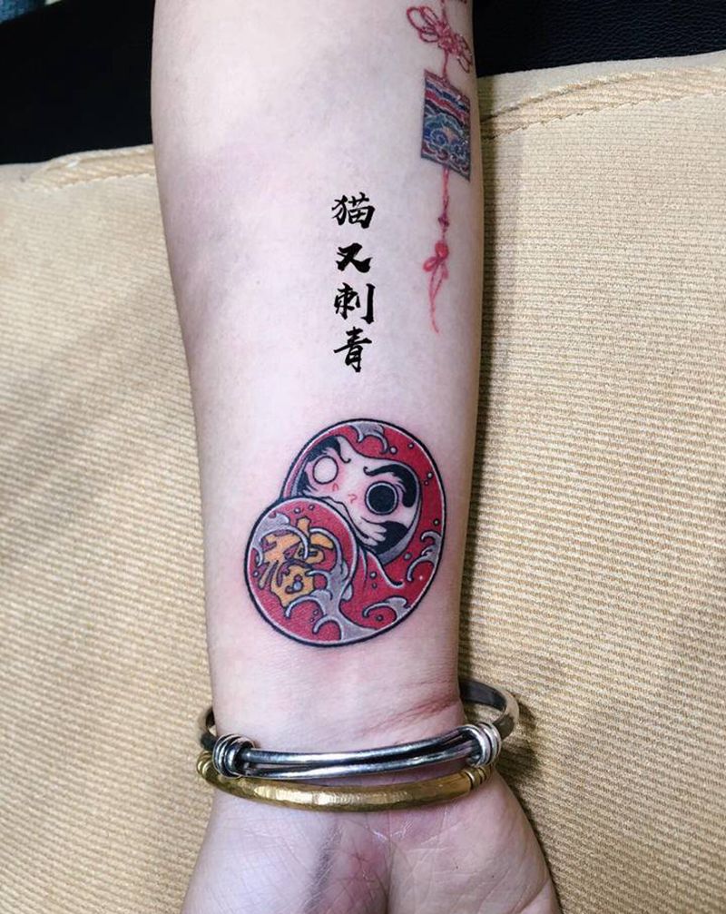 小达摩纹身图片_手臂纹身图案