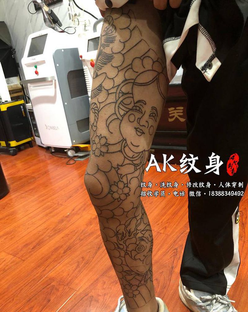 天狗生首花腿纹身图片_腿部新传统老传统纹身图案