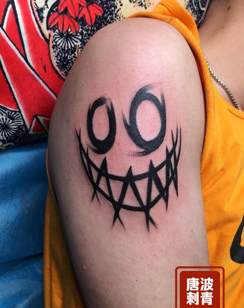 小丑面孔纹身图片_手臂水墨纹身图案