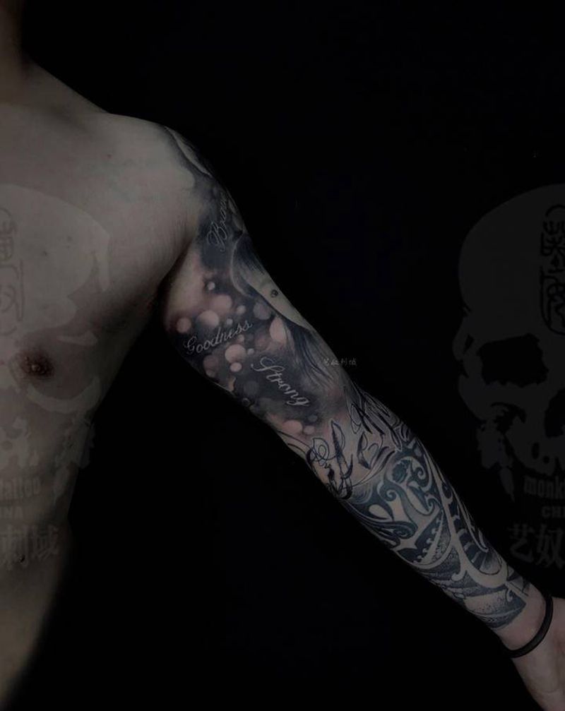 上臂写实肖像纹身纹身图片_手臂欧美写实纹身图案