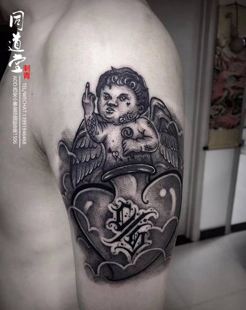 痞子小天使纹身图片_点刺花体字小天使纹身图案