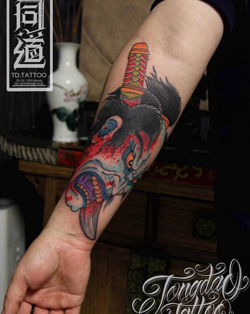 生首纹身图片_手臂老传统生首纹身图案