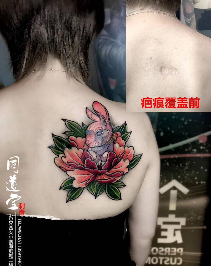 牡丹兔子纹身图片_背部老传统新传统牡丹兔子纹身图案