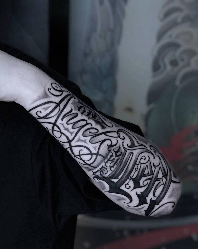 花体字纹身图片_手臂花体字纹身图案