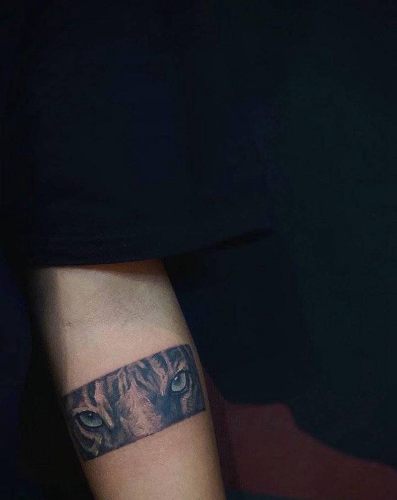 小脑斧纹身图片_手臂欧美写实纹身图案