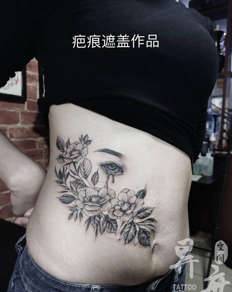 素花纹身图片_腰部腹部点刺素花纹身图案