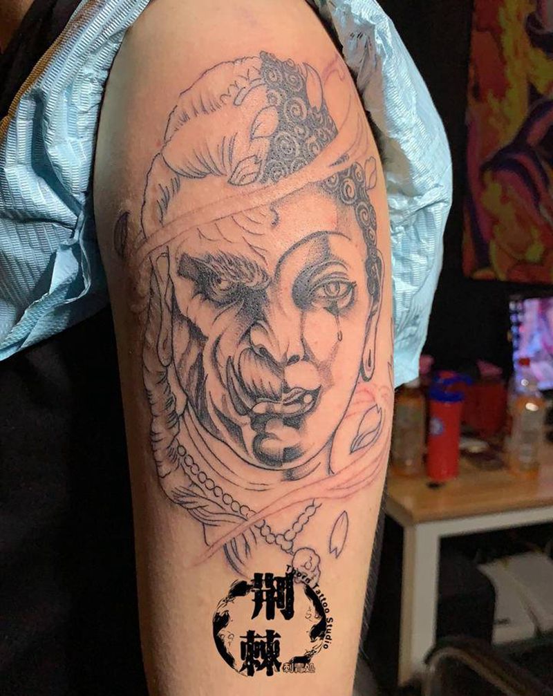 半面佛纹身图片_手臂纹身图案