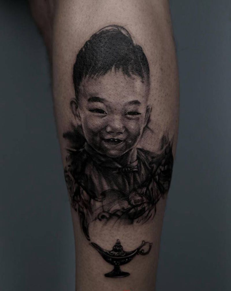 肖像纹身图片_腿部欧美写实纹身图案