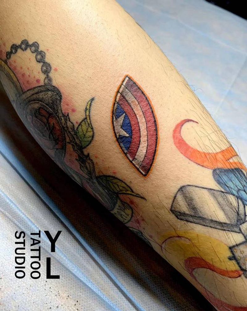 美盾纹身图片_腿部纹身图案