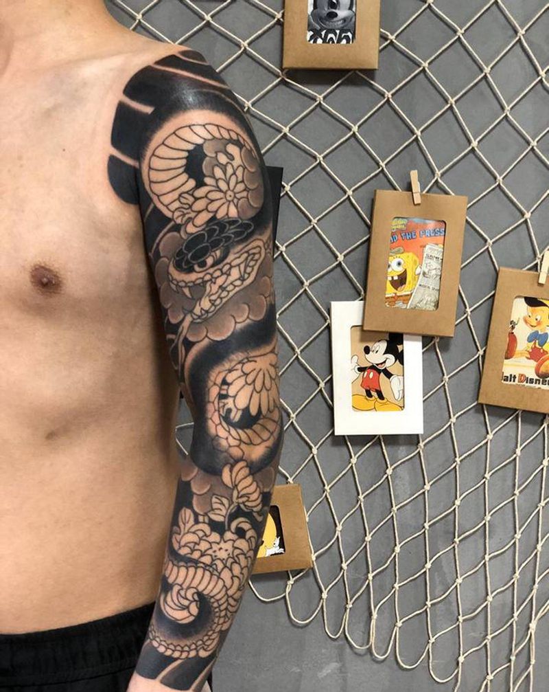 日式花臂未完纹身图片_手臂老传统纹身图案