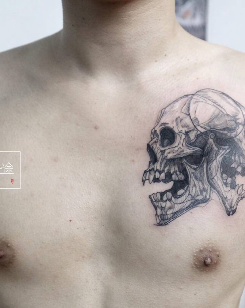 双面骷髅头纹身图片_胸部点刺几何纹身图案