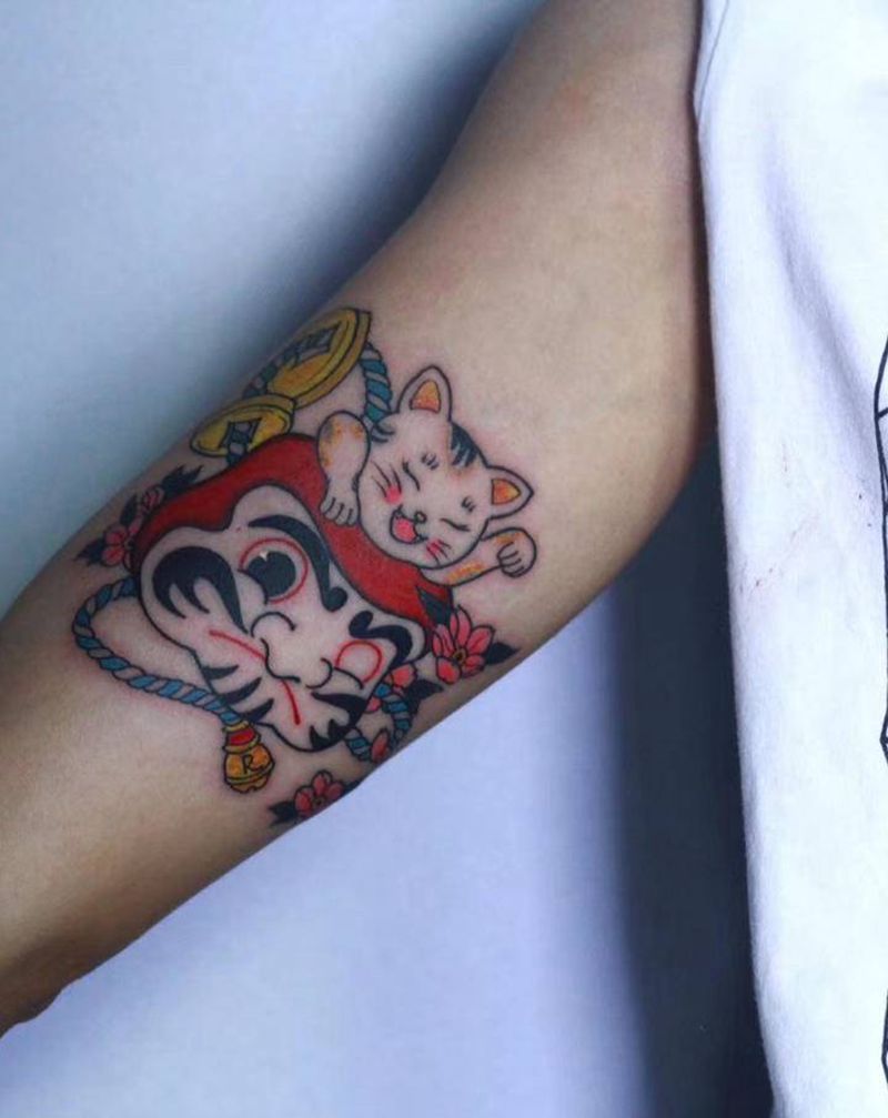 达摩猫纹身图片_手臂老传统达摩猫纹身图案