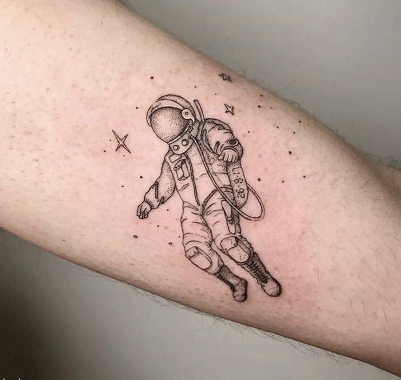 宇航员纹身图片_手臂纹身图案