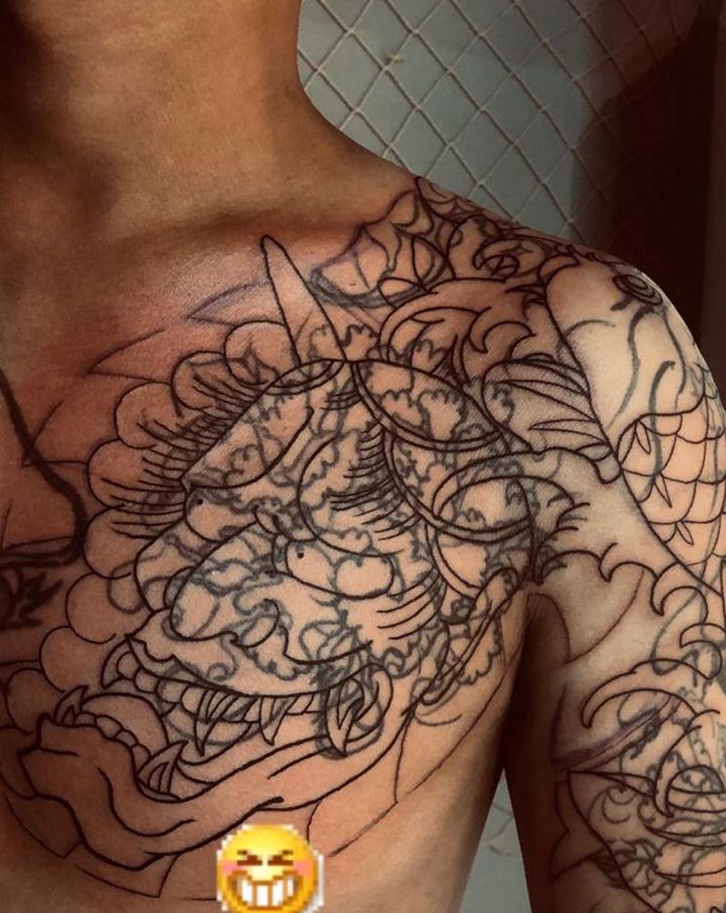 “遮盖”未完纹身图片_胸部手臂老传统纹身图案