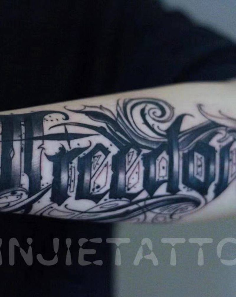 freedom纹身图片_手臂花体字纹身图案